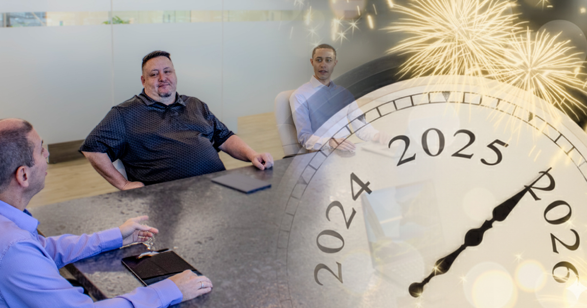 A loan servicing team preparing for year-end with an overlay of a dial moving from 2025 to 2026 and fireworks